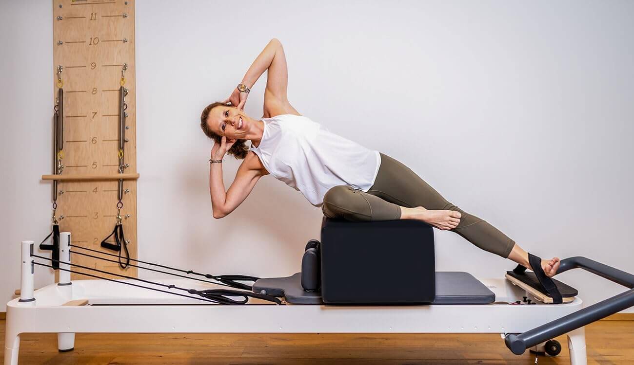 How to Use a Sitting Box for Pilates to Improve Your Alignment